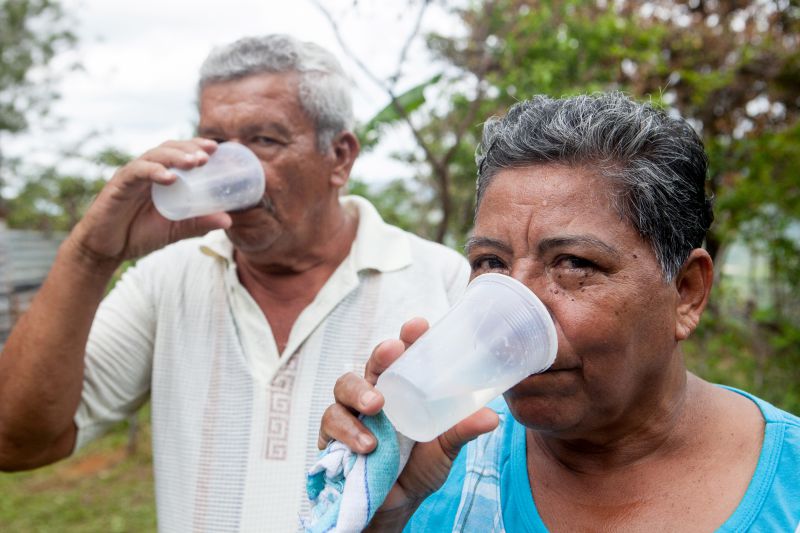 two people drinking water