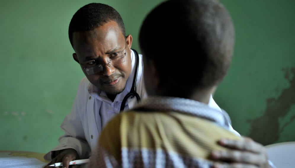 A doctor speaks to a young boy before examining him at a hospital run by Dr. Hawa in the Afgoye corridor of Somalia on September 25.