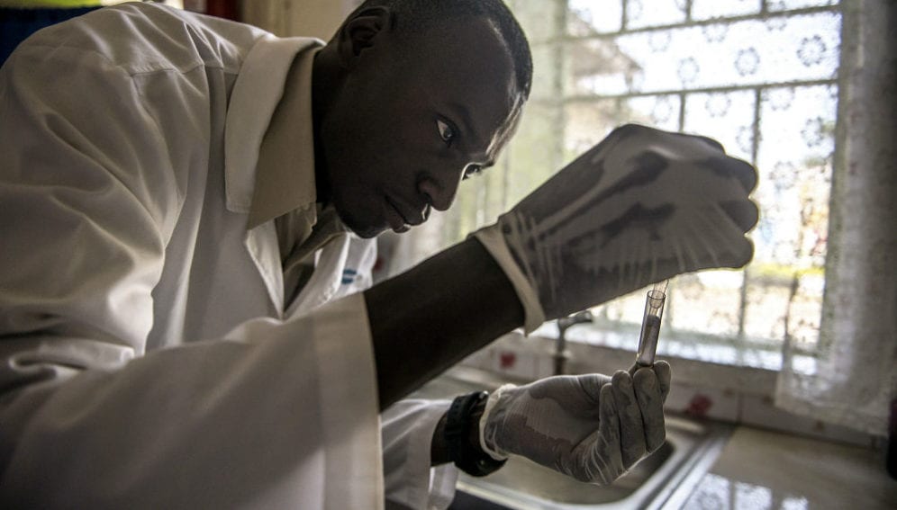 Laboratory technician Denis Bongoyinge prepares a blood sample