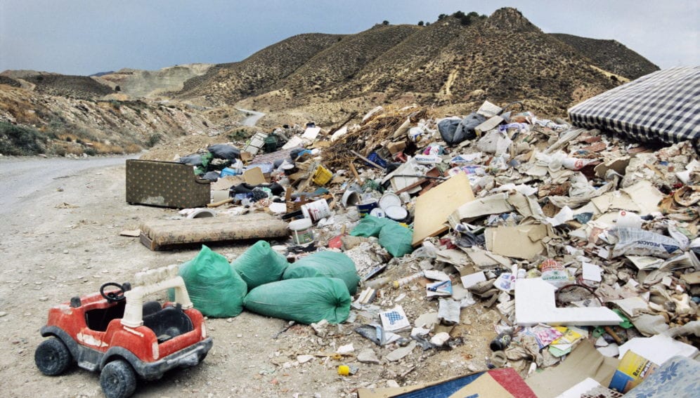Waste from a construction site is dumped in the mountains