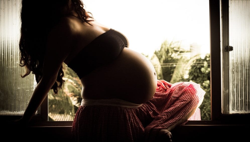 pregnant woman pose for a photo