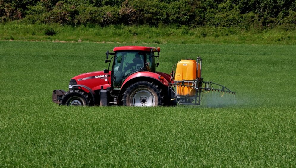 Tractor spraying what firm