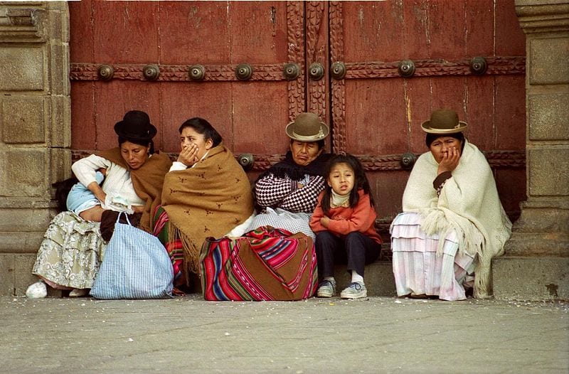 Women and children around the Cathedral dressed in traditional clothes. La Paz, Bolivia