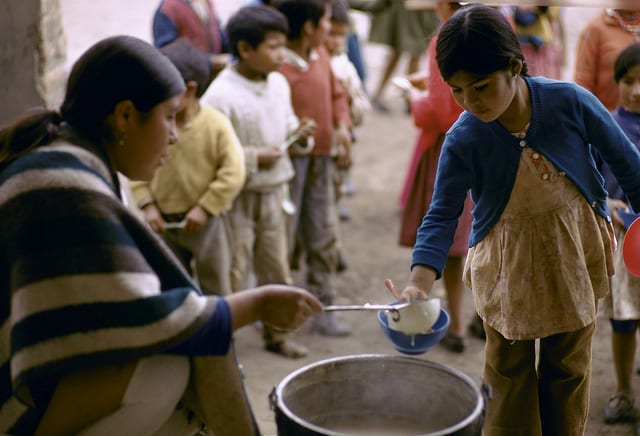 children in line waiting for meal, ecuador