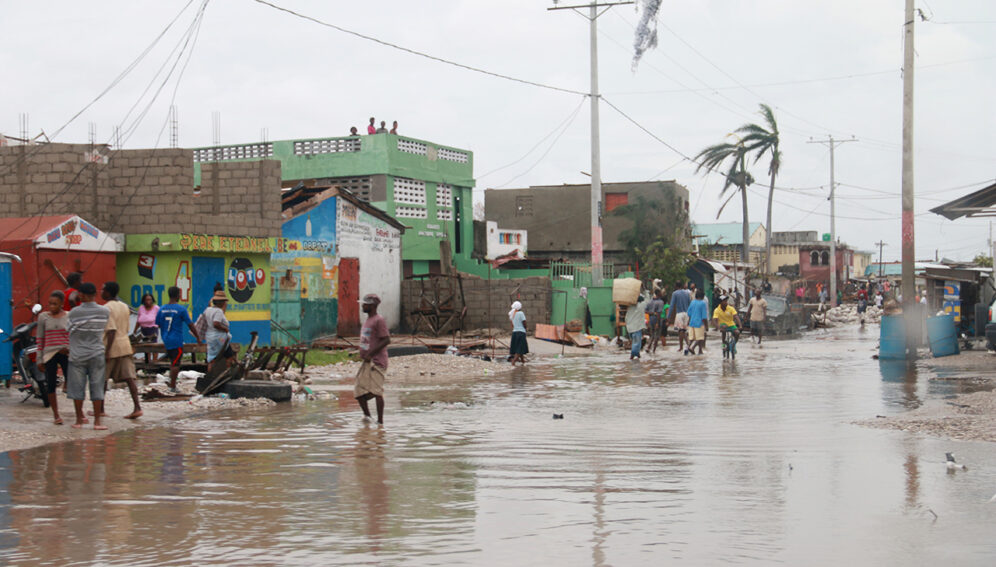 Cayes, southern Haiti, October 5, 2016. Hurricane Matthew has struck Haiti. Immediate aftermath. Red Cross teams assess the situation with authorities and other organizations.

Broken trees, houses, people outside, flooded streets.