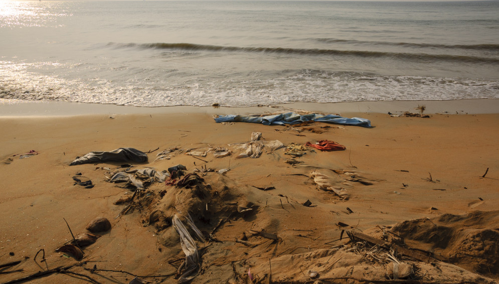 Clothing and bed sheets litter the beach at Khao Lak, Thailand, following the December 26, 2004 tsunami
