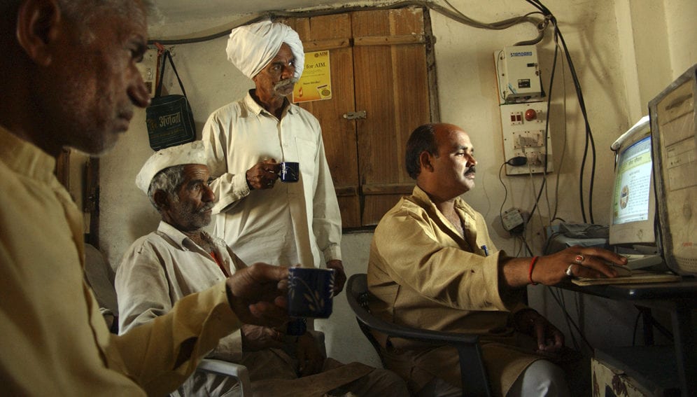 Indian farmers using computer-main