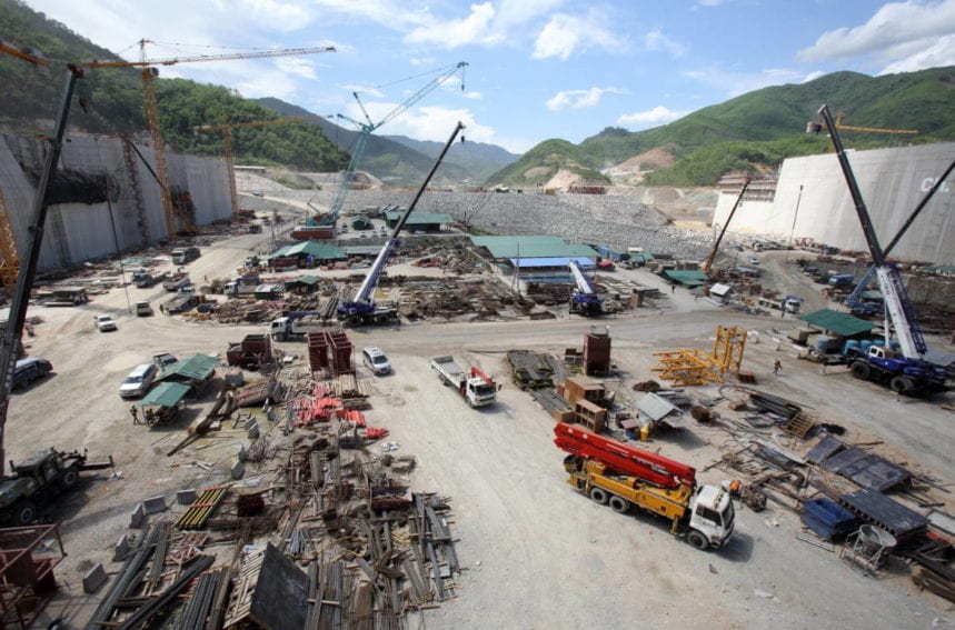 The Xayaburi Dam on the Mekong River dwarfs the construction vehicles building it. It is due to open in 2019 and cost around US$3.5 billion
