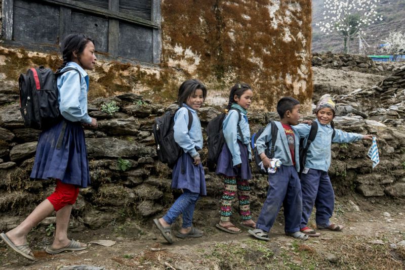 Nepalese children on their way back from a makeshift school