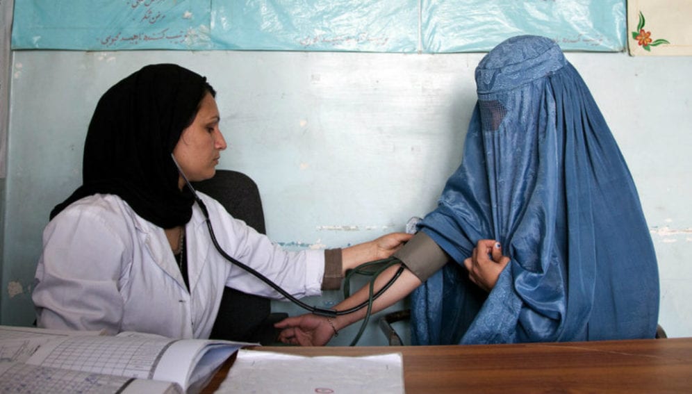 An_Afghan_woman_getting_treated_world_bank