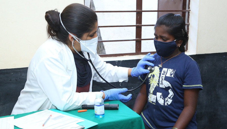 India - student gets checked by health professional