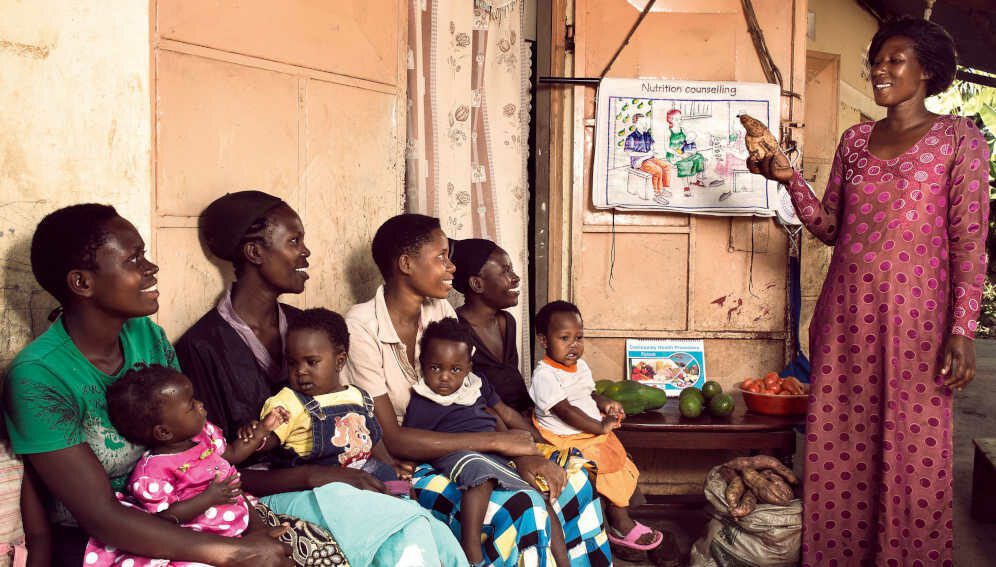 Betty Nabiteeko, 38, teaches mothers with small children about nutrition at her home near Mityebili, Uganda.