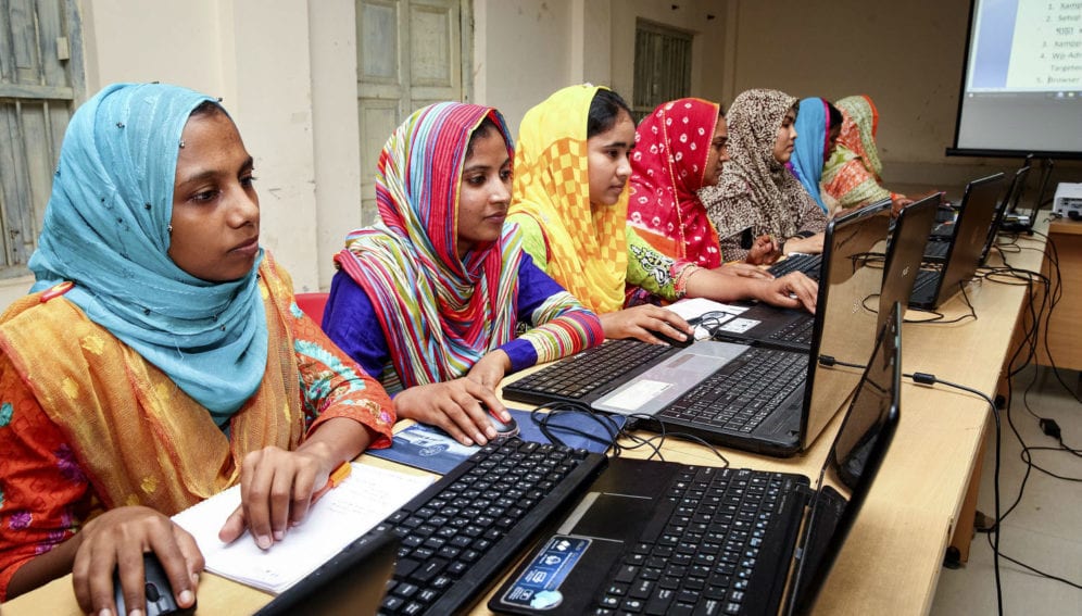 A group of young women of receiving computers