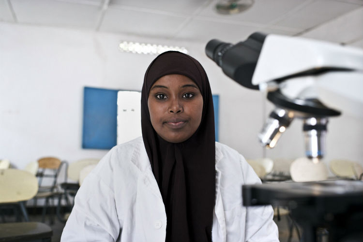 A young woman studies in a science laboratory at Mogadishu University