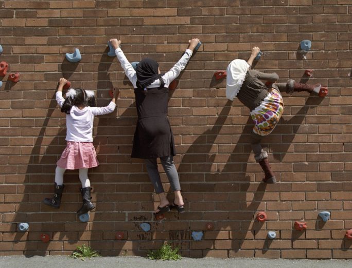 girls climbing wall