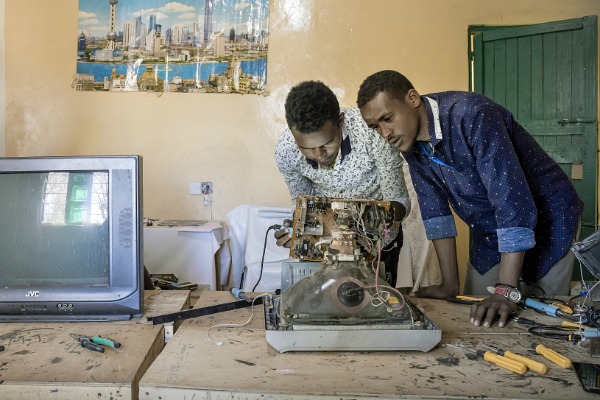 Men repairing TV, Somaliland