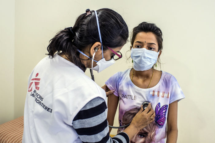 MSF nurse Joshi examines Nischaya, an XDR-TB patient