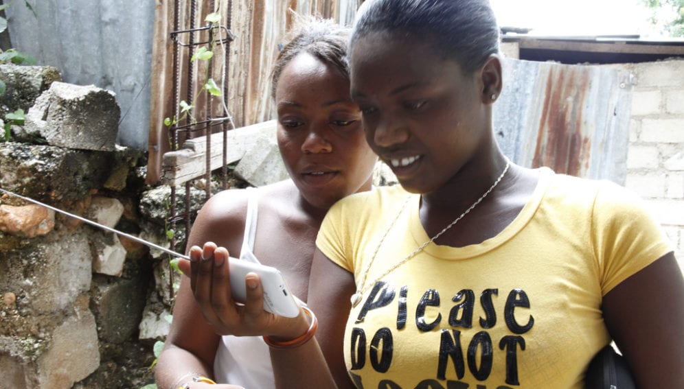 Using Phone after Haiti Earthquake_Flickr_Russell Watkins_Department for International Development