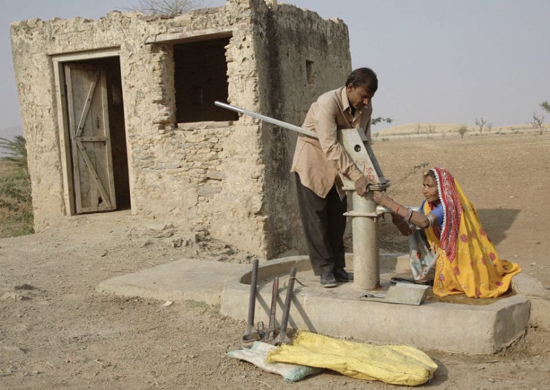 woman repairing water pump