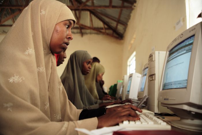 Women work on computers