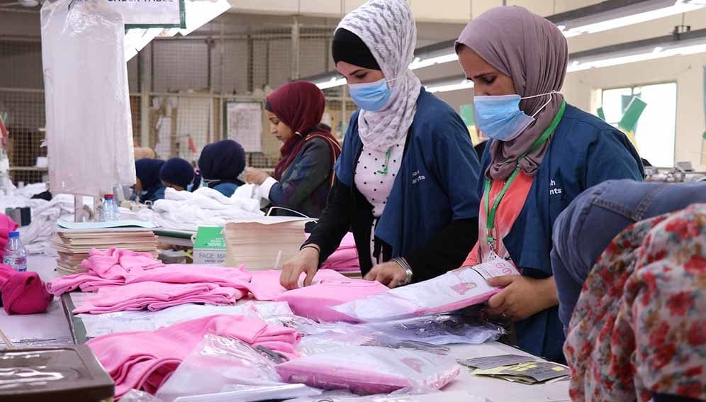 Syrian and Jordanian women employed in a garment factory in one of Jordan's industrial zones