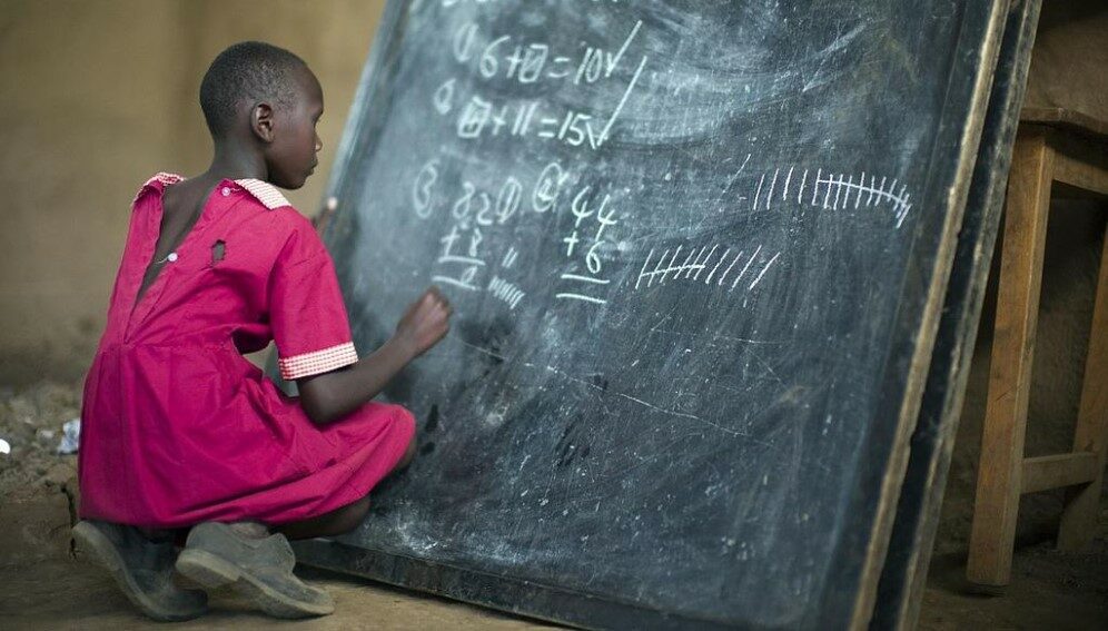 Masai_girl_at_school_doing_maths