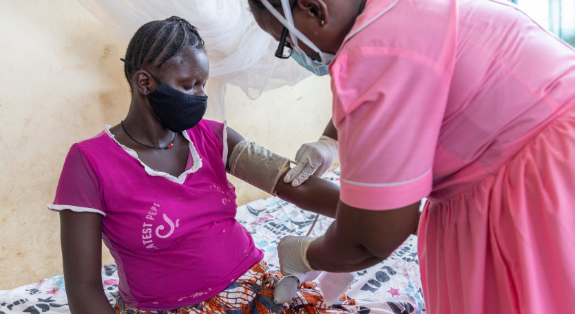 A young woman being attended to by a nurse at a health clinic in Sierra Leone. Researchers have found that a monthly course of the antimalarial combination drug dihydroartemisinin–piperaquine added to a daily regimen of the antibiotic co-trimoxazole reduces the risk of malaria in pregnancy by 68 per cent.