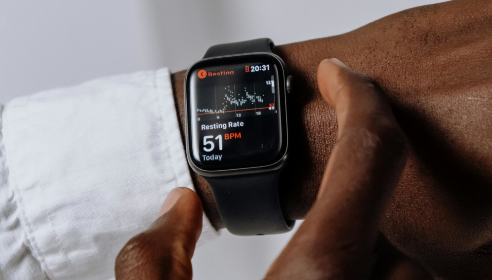 Person Wearing Silver Aluminum Case Apple Watch With White Sport Band (Source: Pexels)