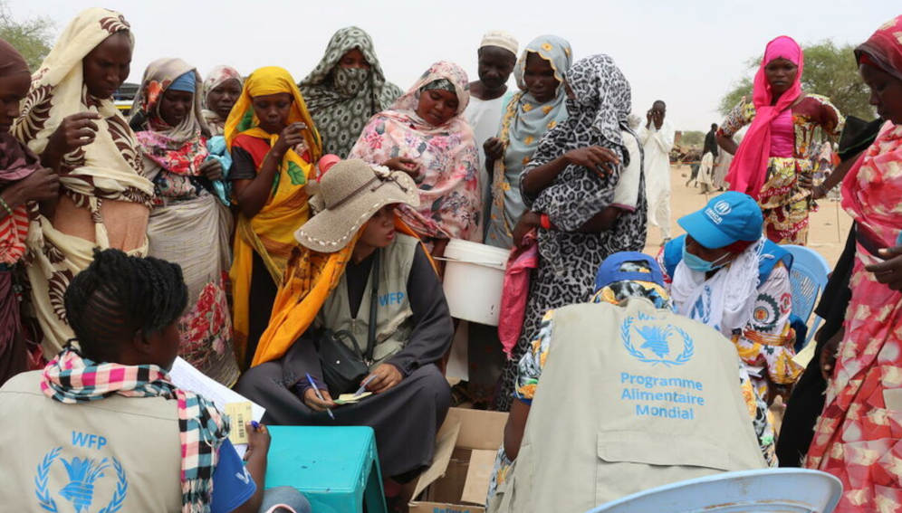 Sudanese refugees collect WFP food assistance in Koufroun, in eastern Chad. Photo: WFP/Jacques David