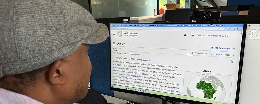 A user reading Wikipedia's Africa page.Photo Courtesy of Davis Weddi.