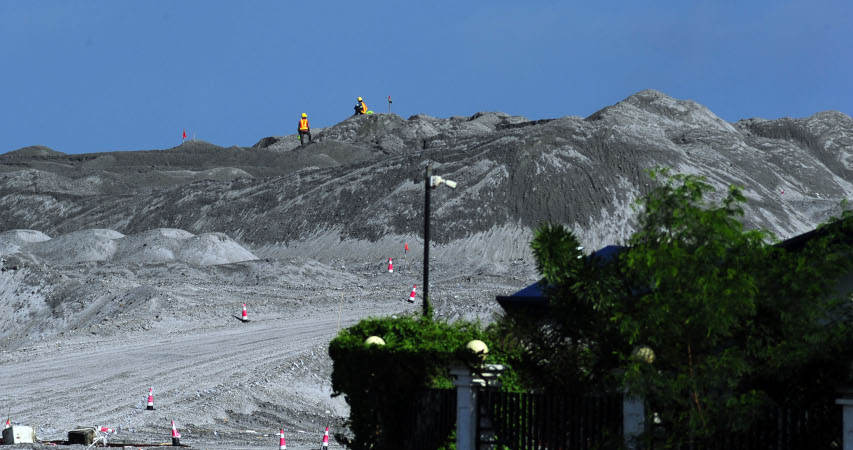 'Workers on top of the new hill.' Photp by Roy Codilla