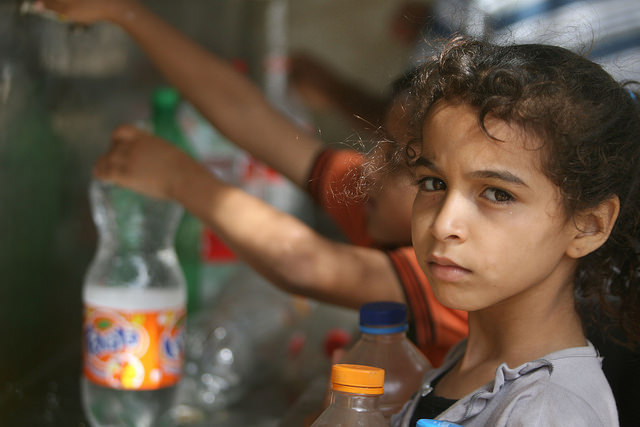 Children in Rafah collect water from one of the working public taps