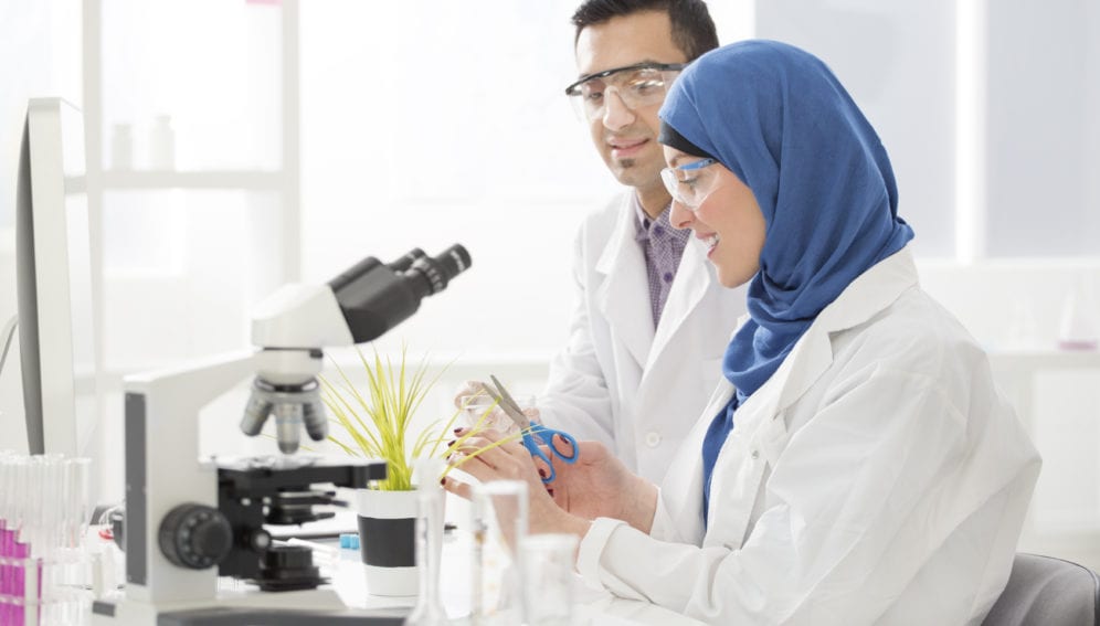 Middle Eastern scientists working in a lab. mena report