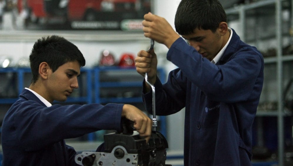 Students work on an engine