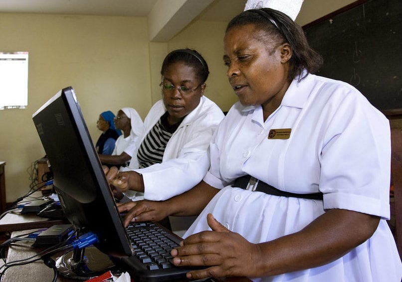 Doctor and nurse receive computer training in Ugandan Hospital Computer Lab