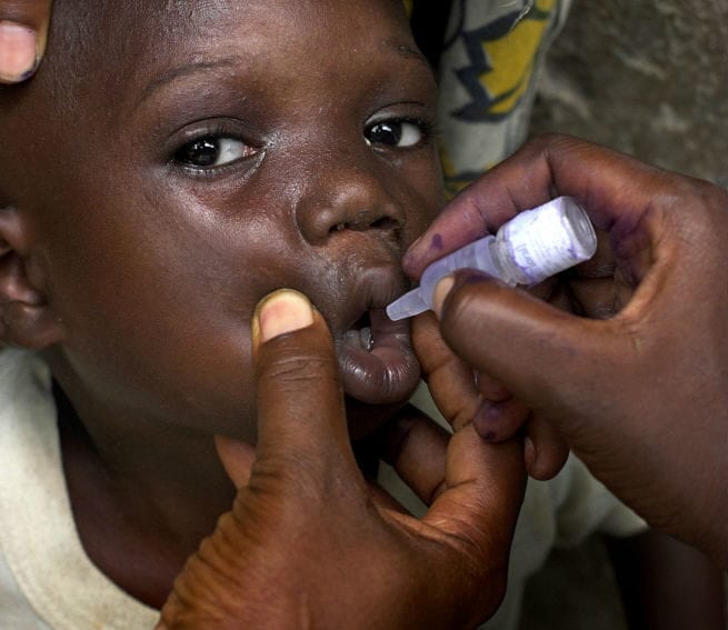 A child receives a dose of the polio vaccine
