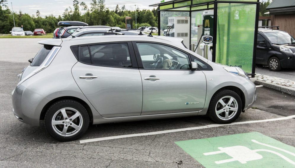 An electric car parked at a charging station