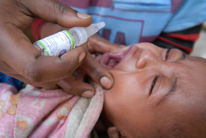 child receives polio vaccination