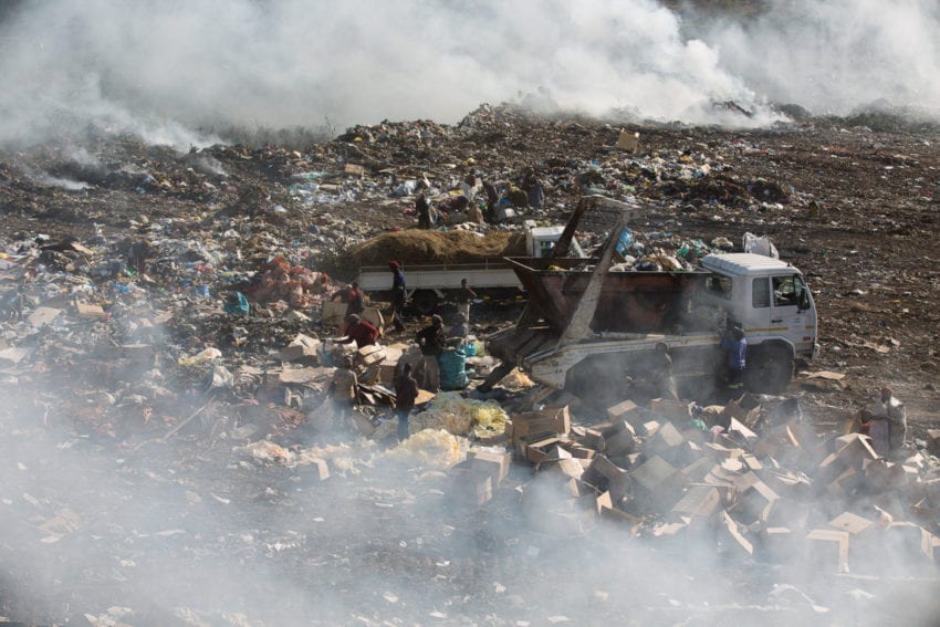 Fires partially obscure the Mahlampswene rubbish dump in Matola. Maputo faces the increasing problem of managing solid waste from its growing population. The city government is considering incinerating the waste to generate electricity
