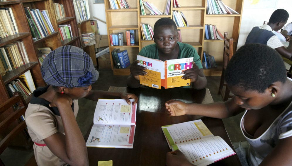 Pupils reading in a school library