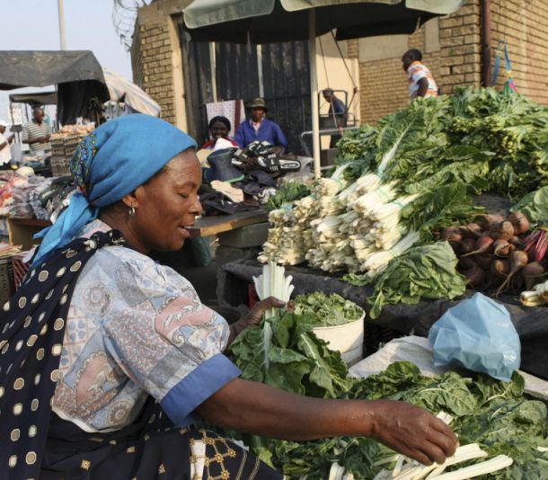 woman sells vegetables