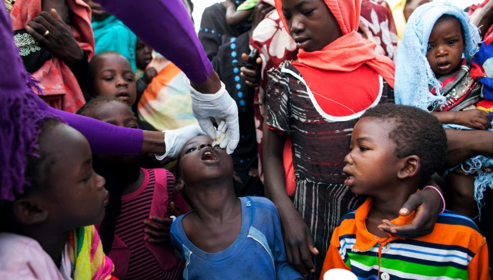 A nurse from the NGO World Vision provides polio vaccination