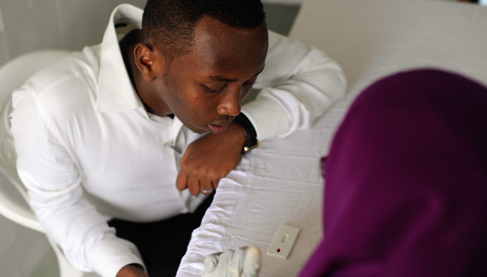 A university student in Mogadishu, Somalia, waits for his HIV test