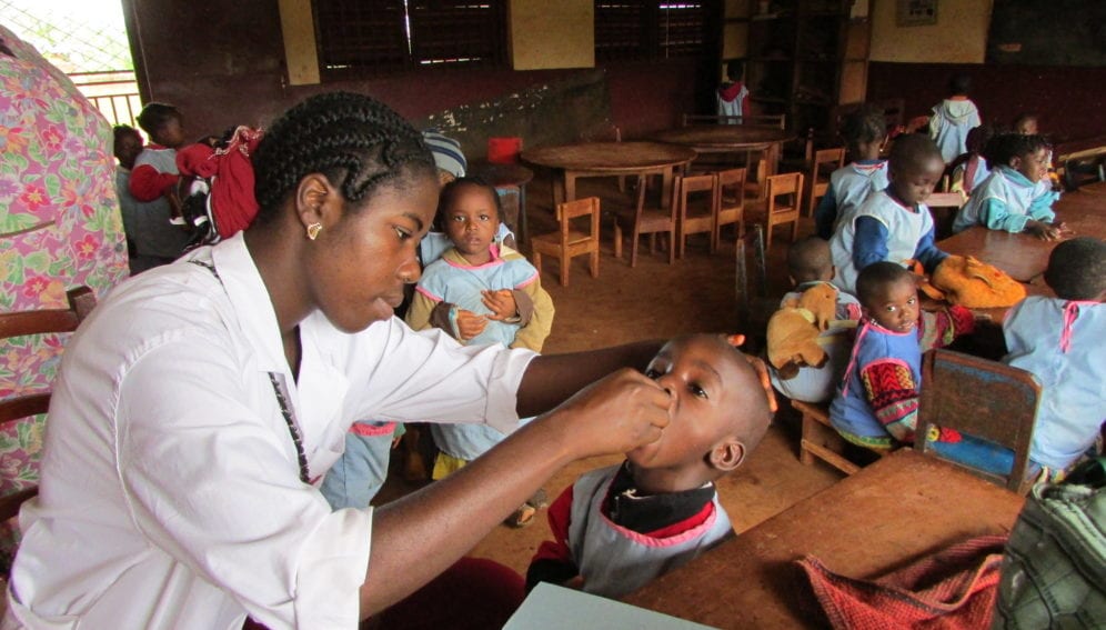 Vaccination team vaccinating children at a nursery school