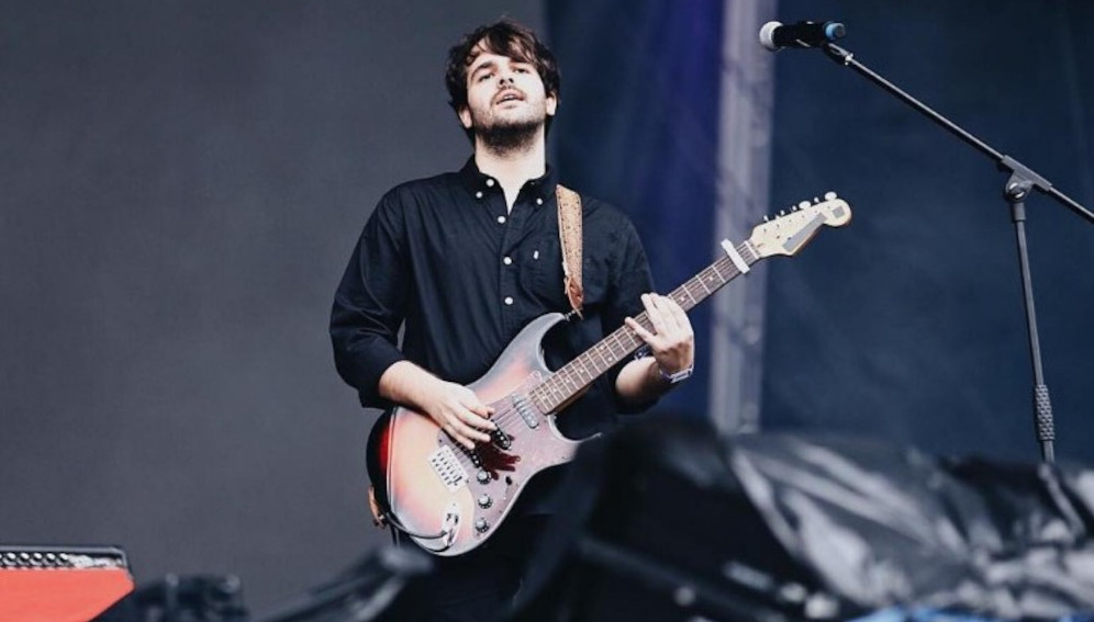 Luden Viana, pictured playing the guitar during a show in Lollapalooza, São Paulo, in 2019. Credit: Courtesy of Luden Viana.