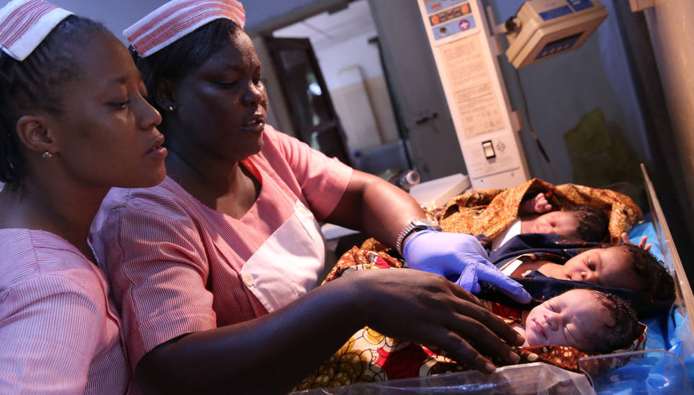 Registered nurses look after newborns Fatmata Bamorie Turay (far left) and Elizabeth Tumoe, registered nurses look after newborns at the Princess Christian Maternity Hospital, in Freetown Sierra Leone. Photo credit: Dominic Chavez/World Bank