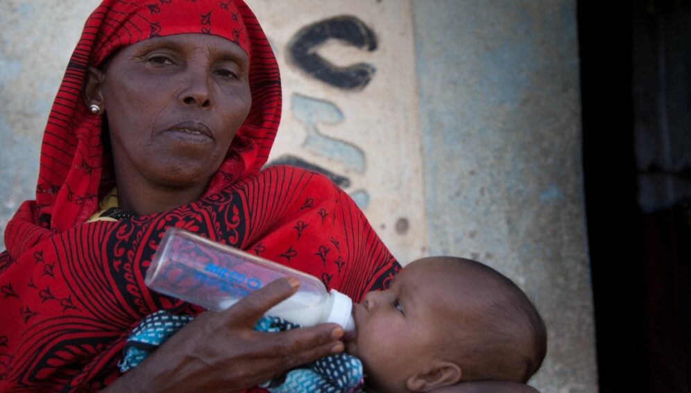 Sophia Ege Bulale feeds her three month old grandson