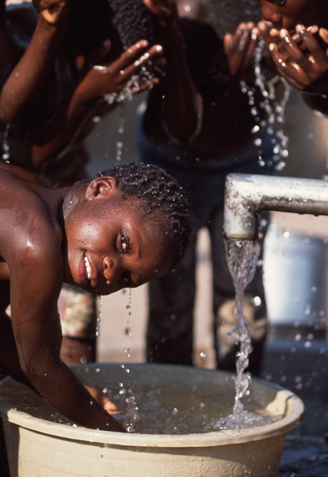 Children wash at a newly installed well in Malawi. In all, 2.4 million Malawians lack access to safe water and 14.3 million — or 90 per cent — lack access to adequate sanitation, according to charity WaterAid
