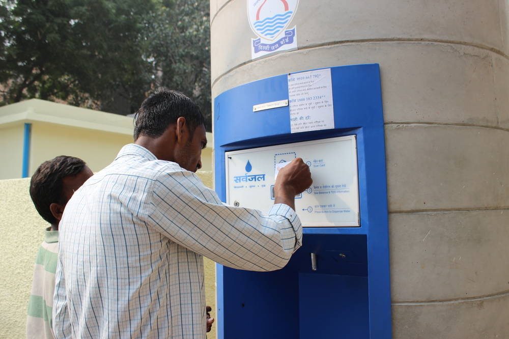 A user scans a prepaid Sarvajal smartcard, which will enable him to find out his remaining balance, the water quality and how much water can be withdrawn. Water can be collected 24 hours a day with this card. Each costs 100 rupees (about US$1.60), 50 of which is a security deposit, and can be topped up at the treatment plant
