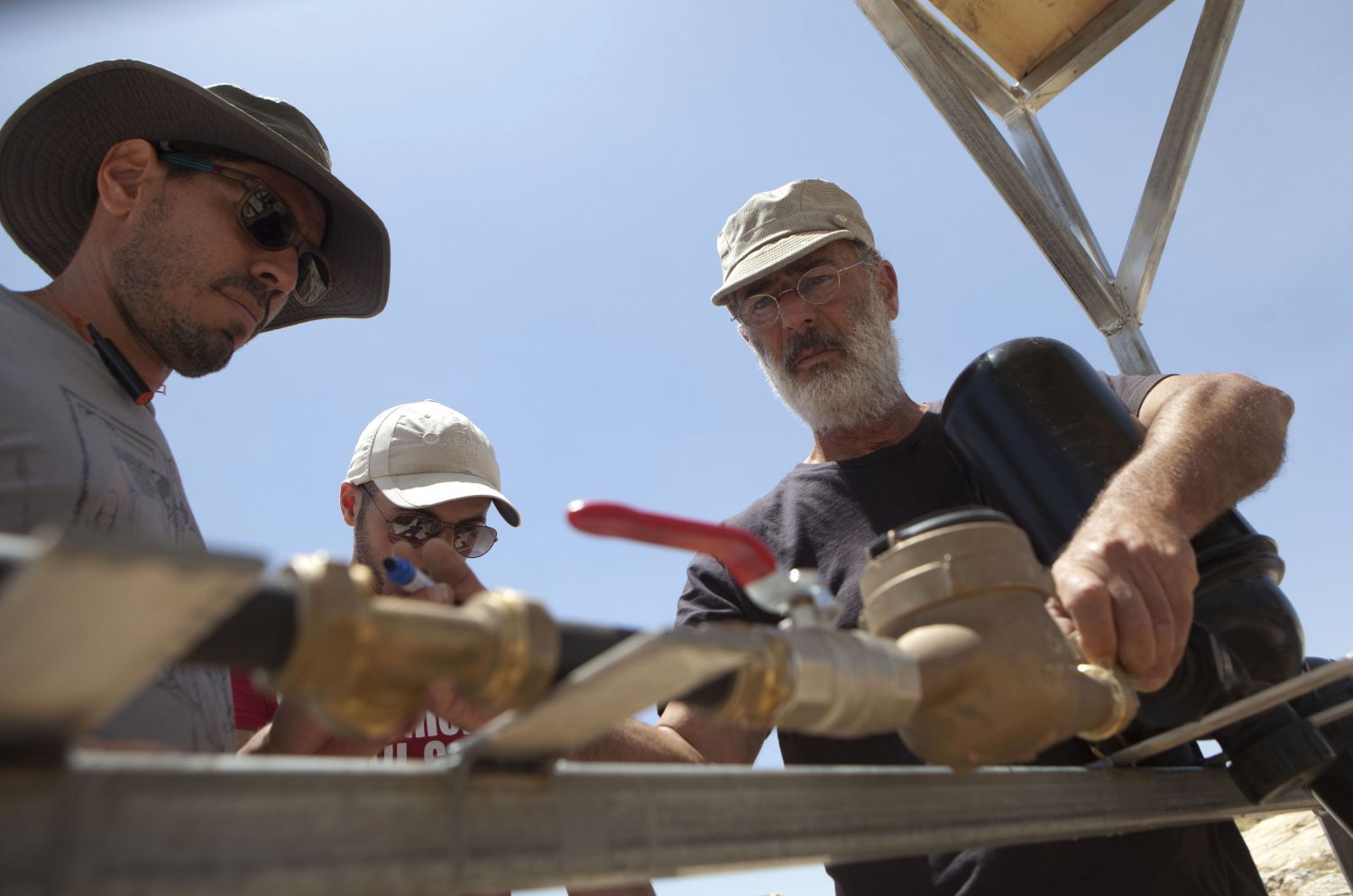 Many Palestinians in Mount Hebron rely on rainwater harvesting. Because this often fails to meet their needs, families have paid high prices for extra water brought in by tanker. To reduce this burden, Comet-ME supplies equipment to improve access to clean water. Here the team are installing meters to monitor water use for new water systems

